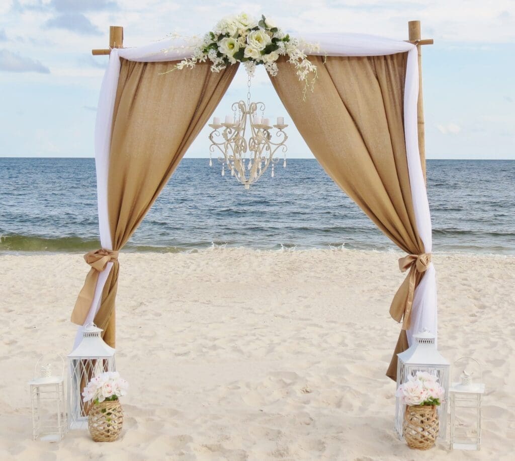 Burlap and white Wedding Ceremony Arch by Beach Weddings Alabama