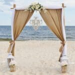 Burlap and white Wedding Ceremony Arch by Beach Weddings Alabama
