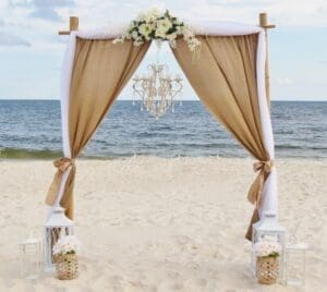 Burlap and white Wedding Ceremony Arch by Beach Weddings Alabama